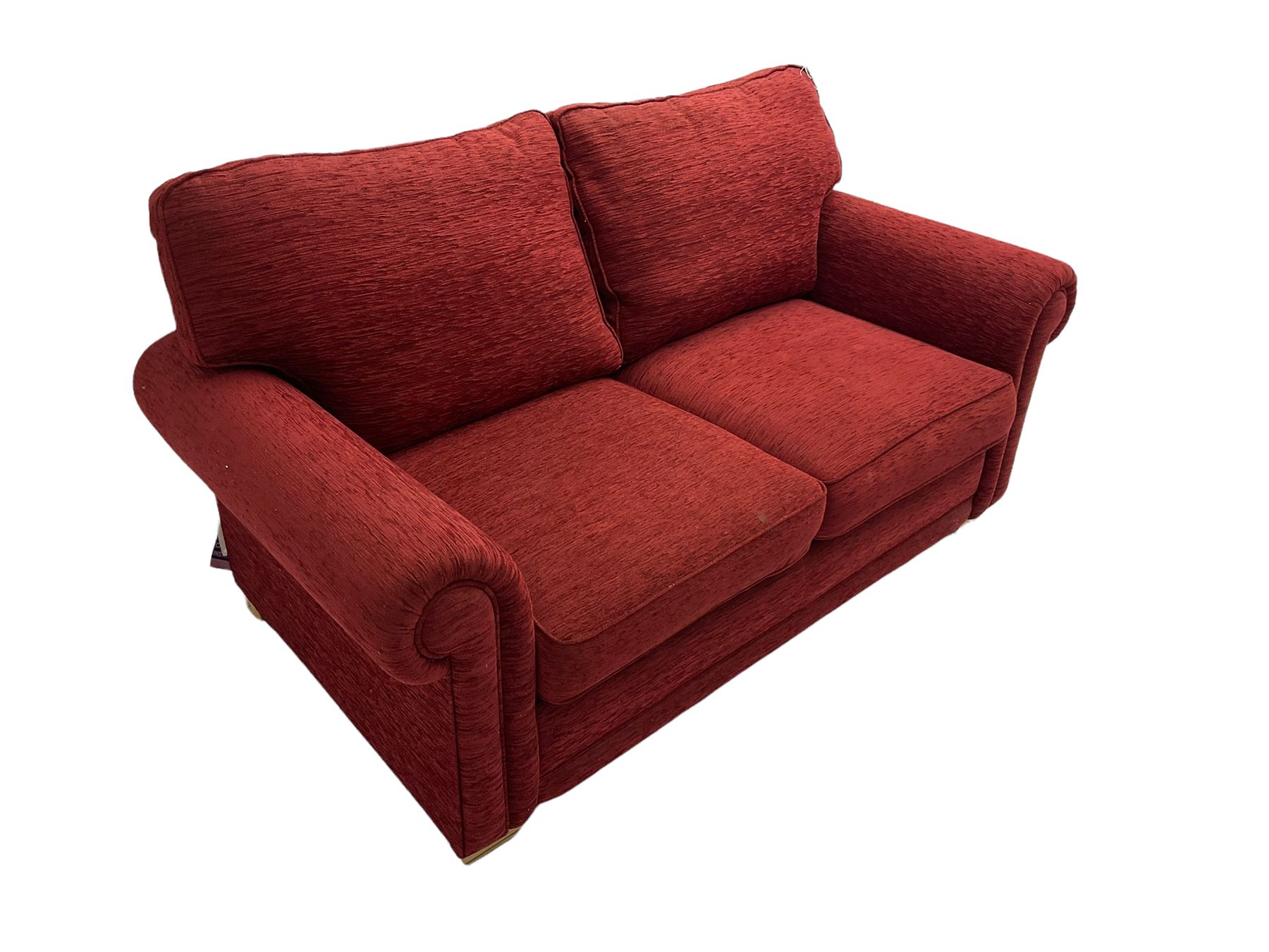 Two seat metal actions sofa bed upholstered in red cover