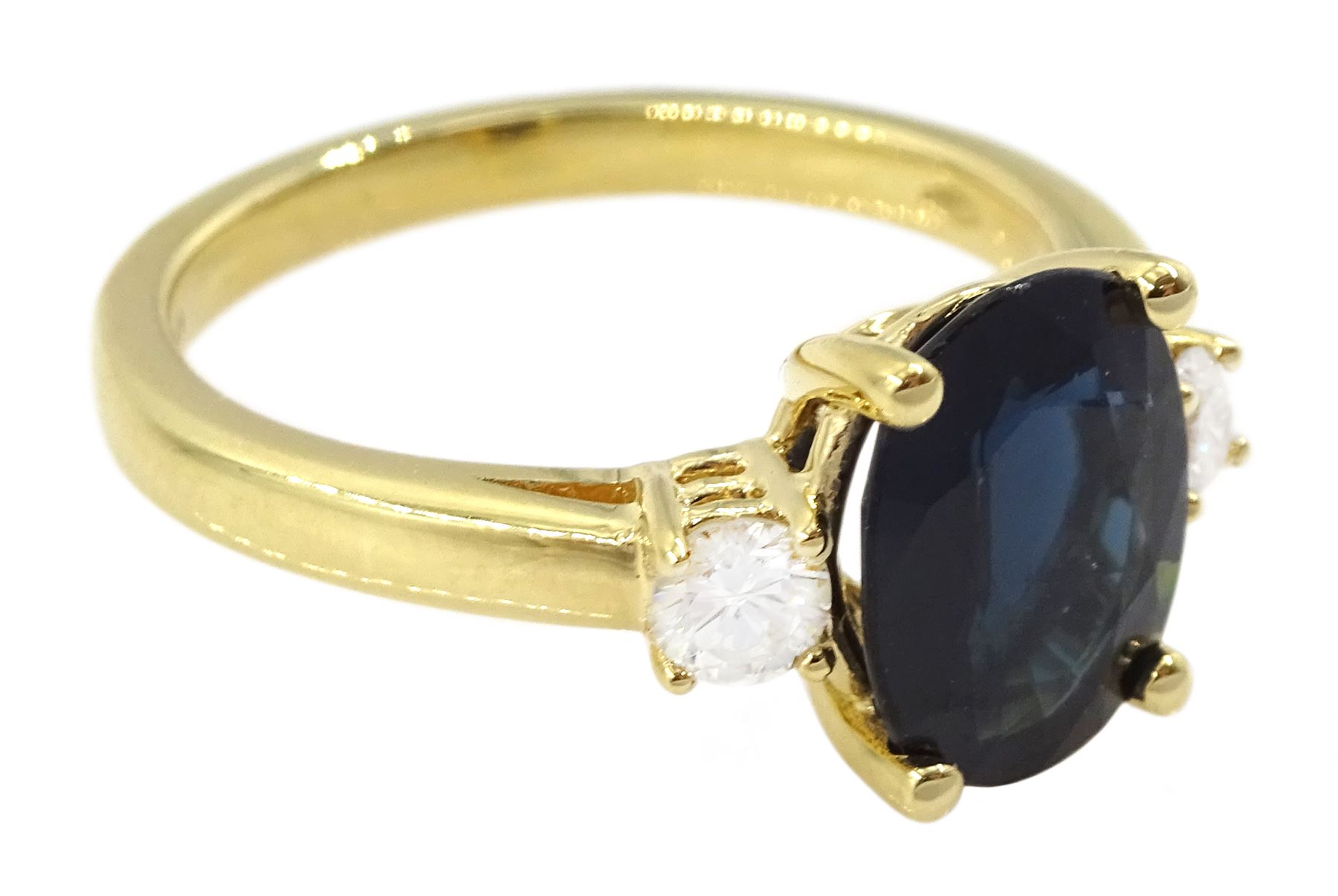18ct gold sapphire and diamond three stone ring, single oval sapphire of approx 2.20 carat, with a single round brilliant cut diamond set either side, hallmarked, total diamond weight approx 0.25 carat