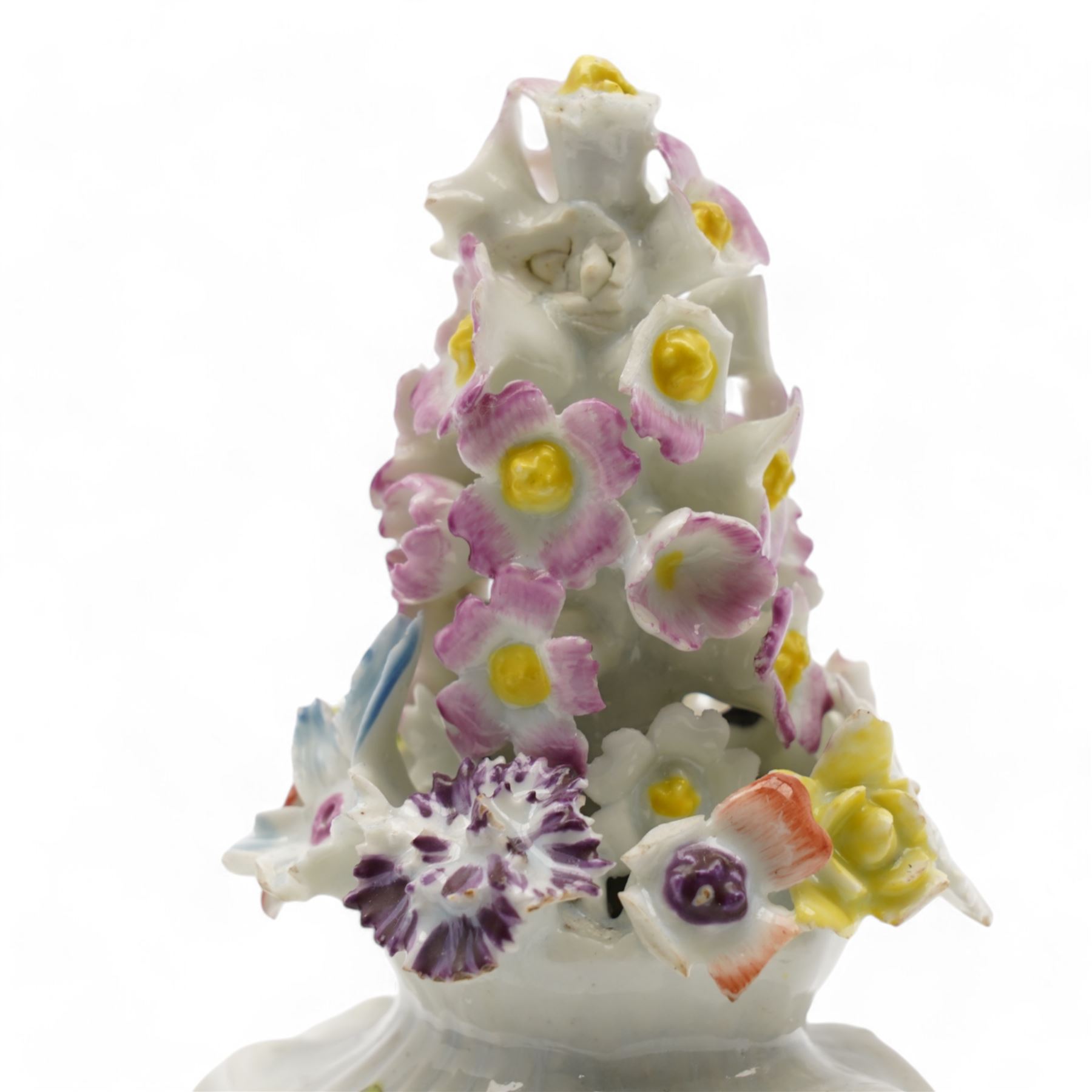 Longton Hall floral table ornament, circa 1755, the moulded rococo base painted with floral sprays and sprigs, below a floral encrusted arrangement, unmarked, H14.5cm 