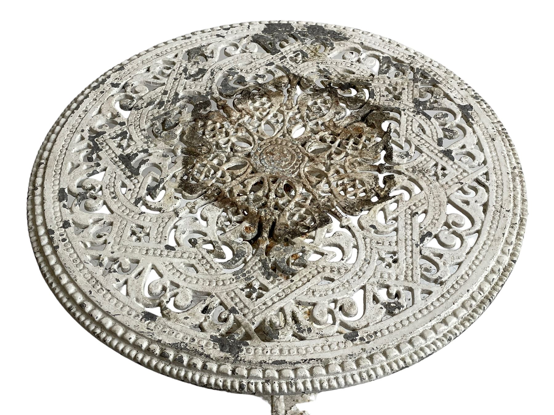 Coalbrookdale design - 19th century cast iron and cast alloy garden table, circular top with beaded edge pierced with scrolls, the pedestal decorated with scrolling and foliate motifs triple arm platform bass with scrolled feet