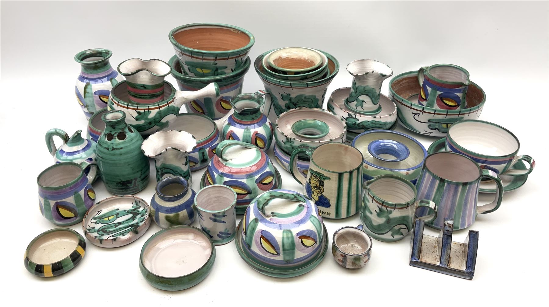 A collection of Tintagel Cornish pottery, to include various planters, jugs, vases, etc., a number of pieces decorated in dragon pattern. 