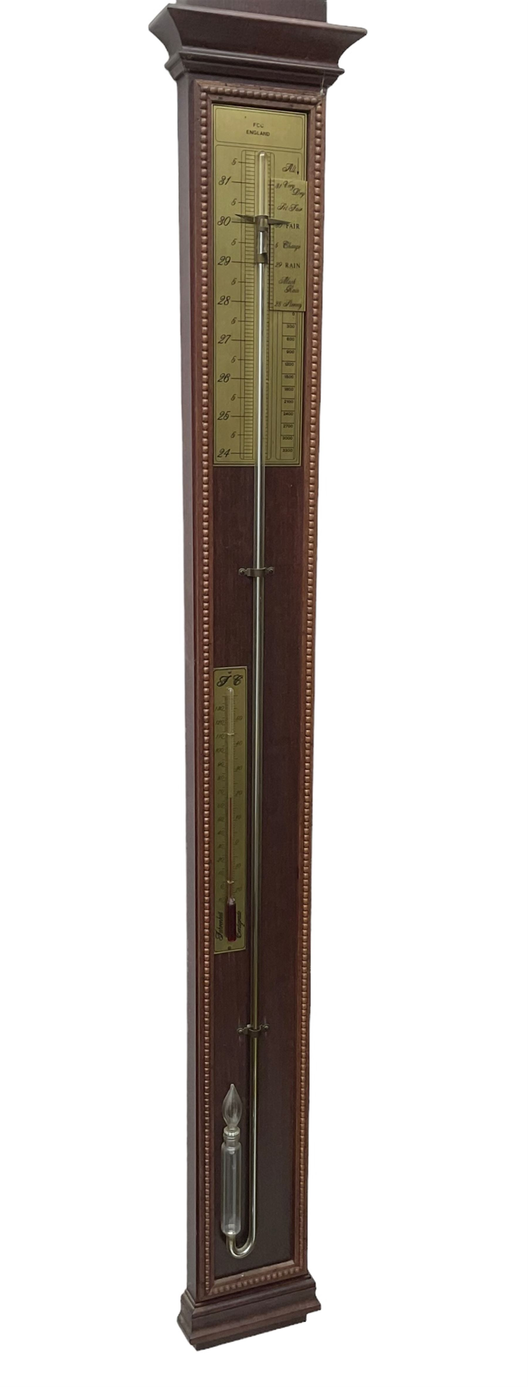 20th century - Replica mercury wall mounted stick barometer, fully glazed case with a gilt register measuring air pressure in inches, adjustable vernier and recording pointer, with a conforming thermometer  recording the temperature in degrees Fahrenheit and Celsius.  