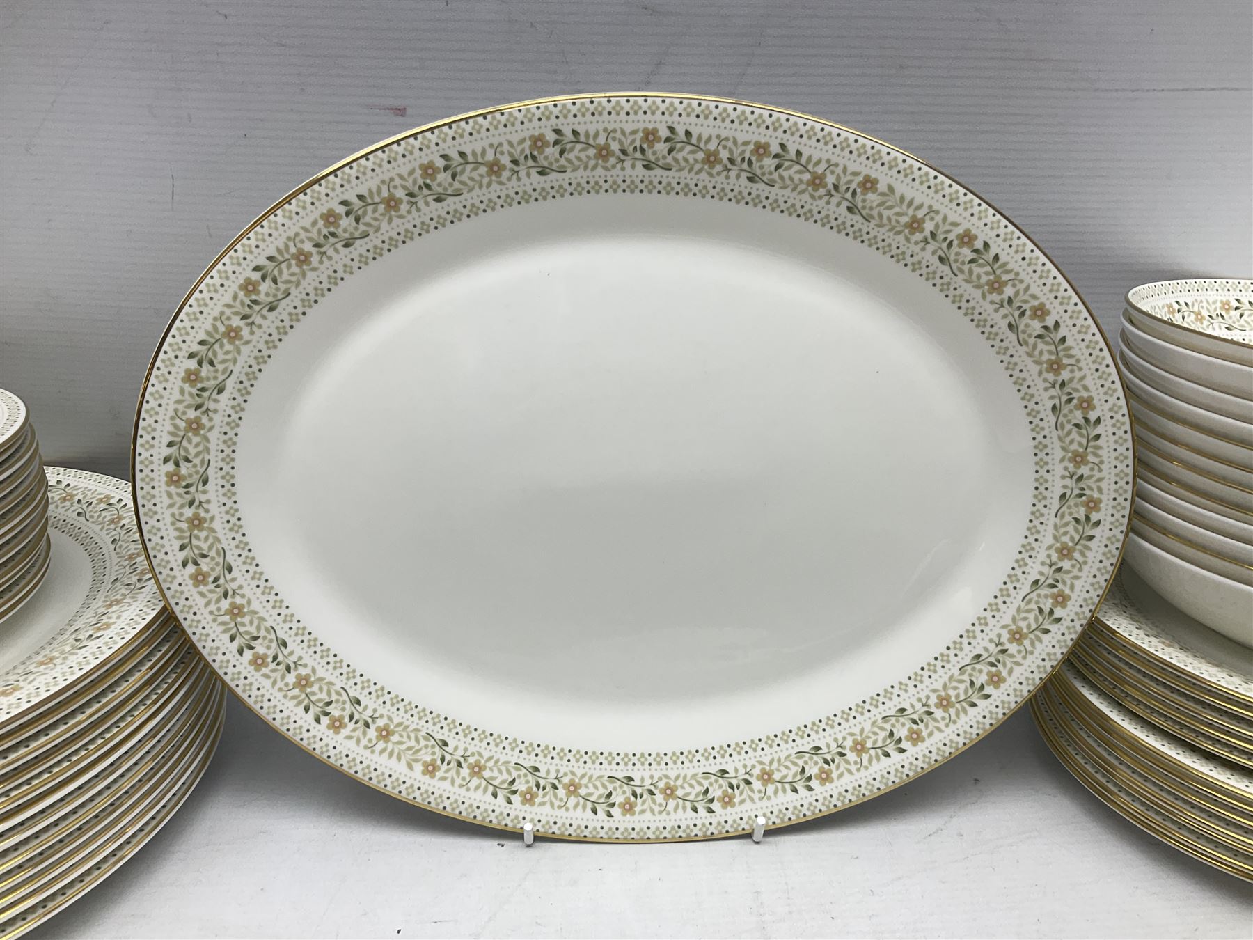 Royal Doulton Paisley pattern tea and dinner service for twelve, comprising dinner plates, side plates, soup bowls, dessert bowls, tea plates, two lidded tureens, sauce boat and saucer, sucrier and jug, oval serving dish and teacups and saucers