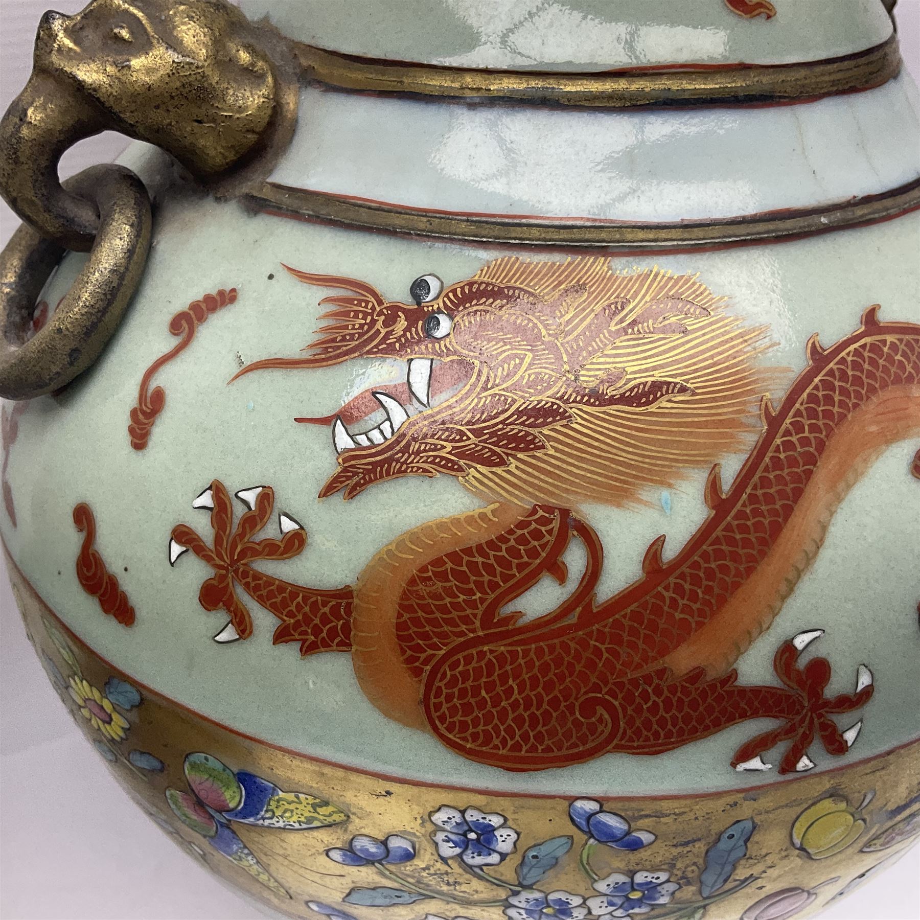 Pair of early 20th century Chinese vases decorated with dragons chasing a flaming pearl, with a gilt border of butterflies and floral sprigs, with Elephant head handles, H44cm 