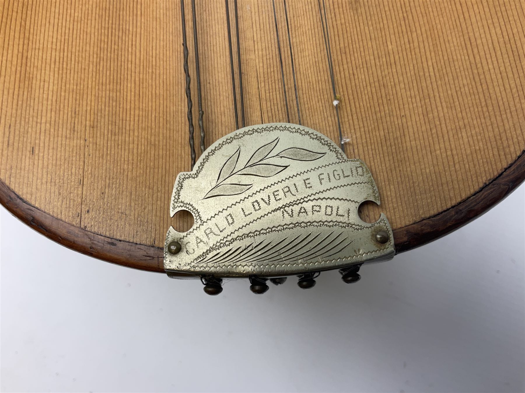 Italian mandolin, with foliate inlaid scratchplate, paper label inscribed 'Carlo Loveri & Figlio of Napoli', L62cm
