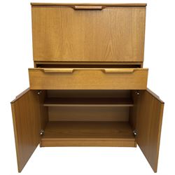 Mid-20th century teak bureau, fall front enclosing fitted interior, one long drawer over double cupboard 