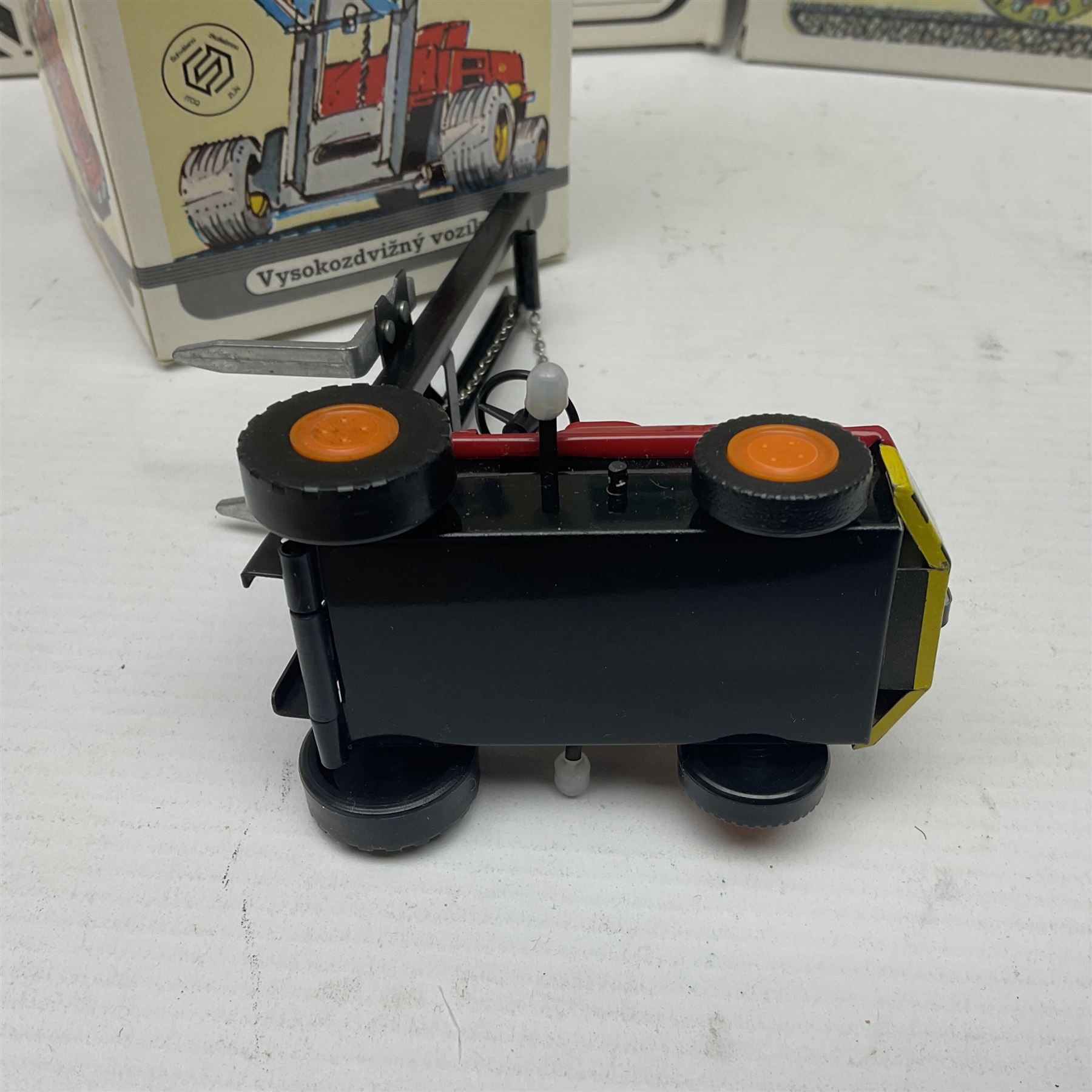 Kovap - eleven tinplate models to include Tractor and Trailer, Road Roller 1927, Moving Moneybox 1924, Hawkeye type B 1924, Boy on a Tricycle; all in original boxes 