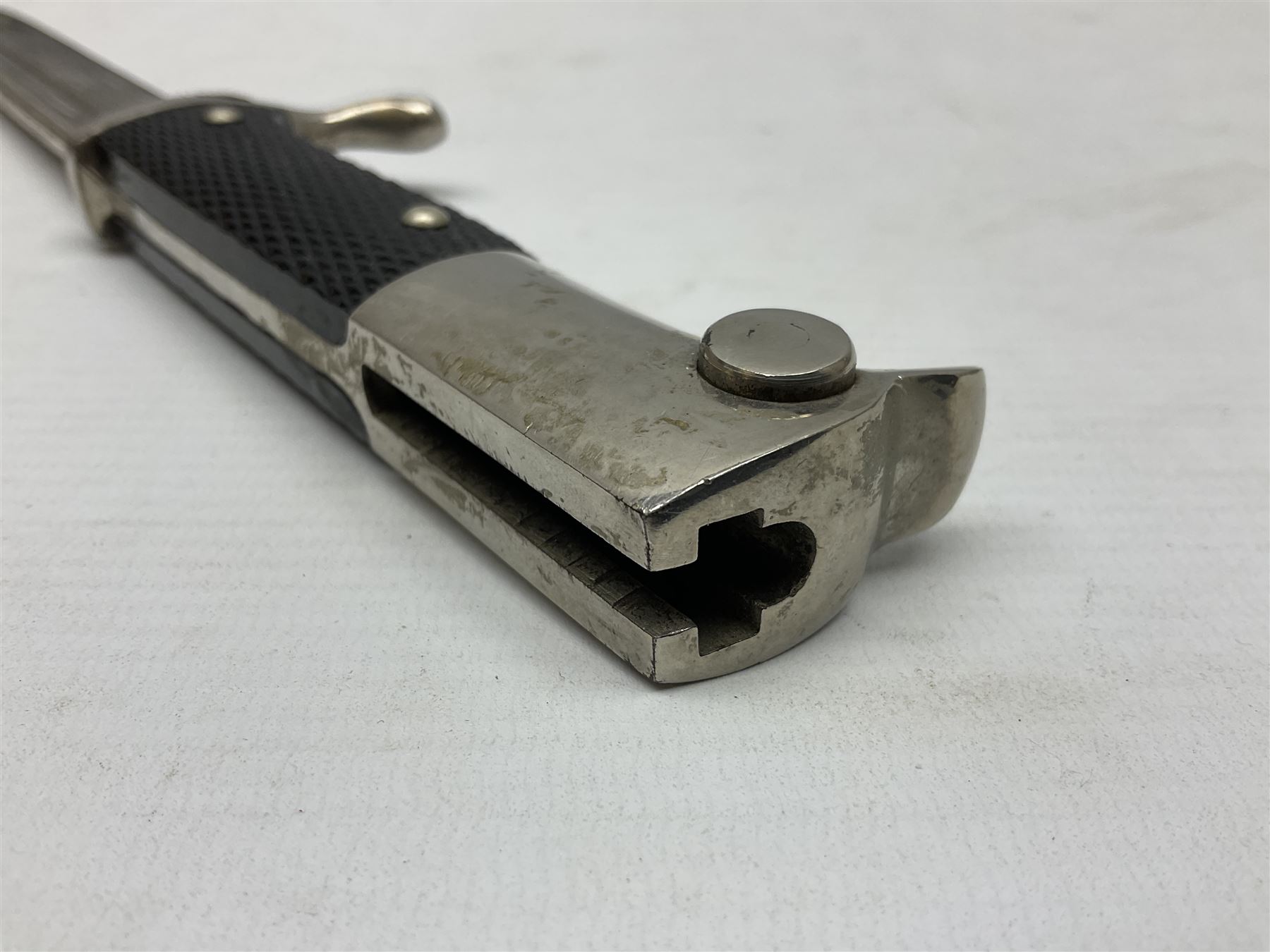 German Wehrmacht KS98 dress bayonet, with plain 19.5cm fullered blade marked Anton Wingenje Solingen, chequered black plastic grip and original leather washer to ricasso; in black painted metal scabbard L36cm overall