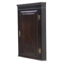 George III country oak corner cupboard, enclosed by single cushion panelled door, brass H hinges