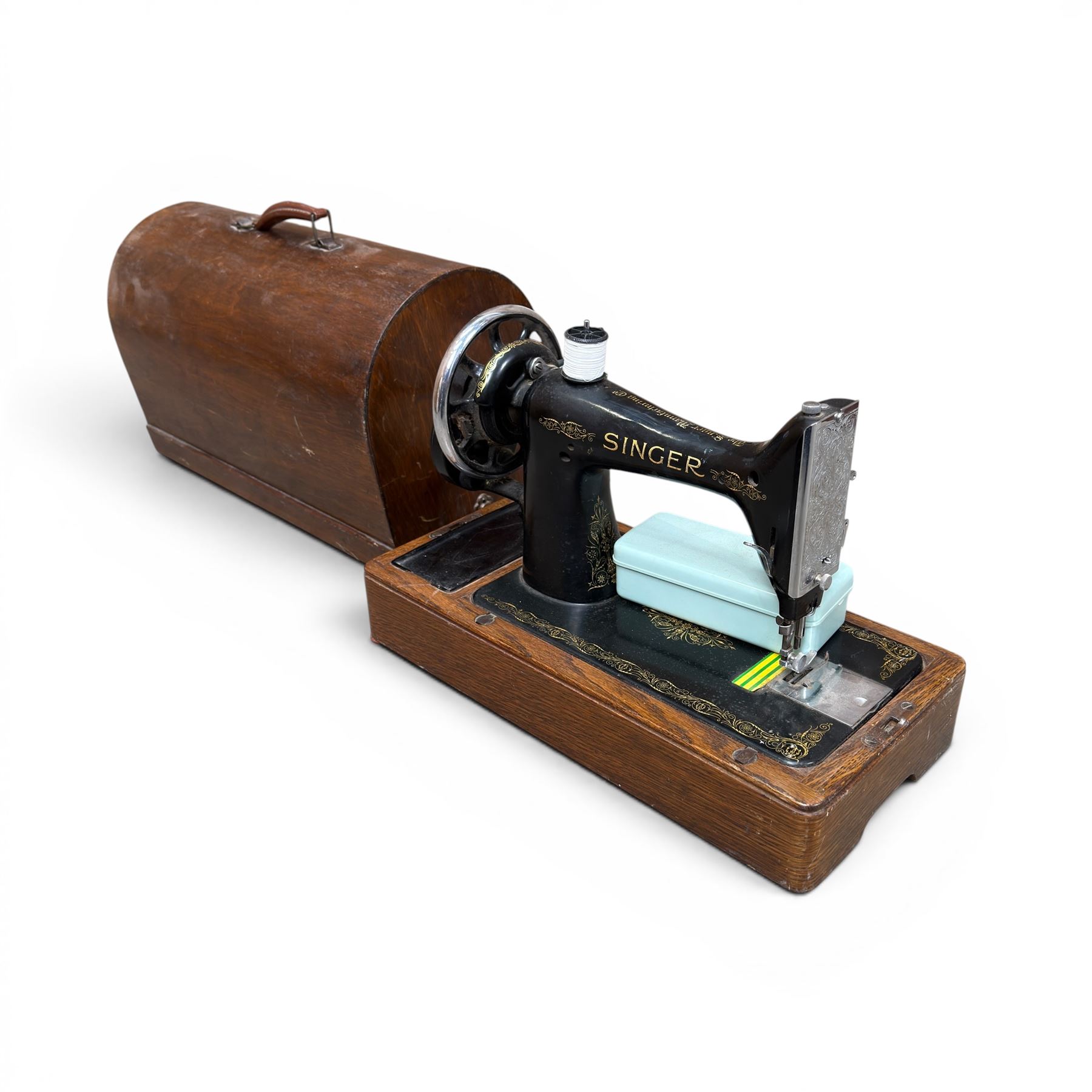 Three Singer wooden cased sewing machines 