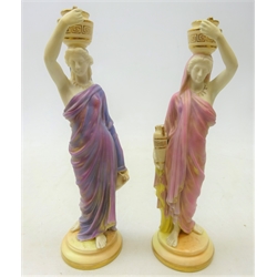  Pair of early 20th century Royal Worcester figures modelled as two female water carriers no. 2/125, H24cm   