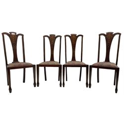 Set of four Edwardian stained beech dining chairs, shaped cresting rail over splat inlaid with trailing bell flowers, upholstered drop-in seat, on square tapering supports with spade feet; pair of Victorian oak dining chairs (6)