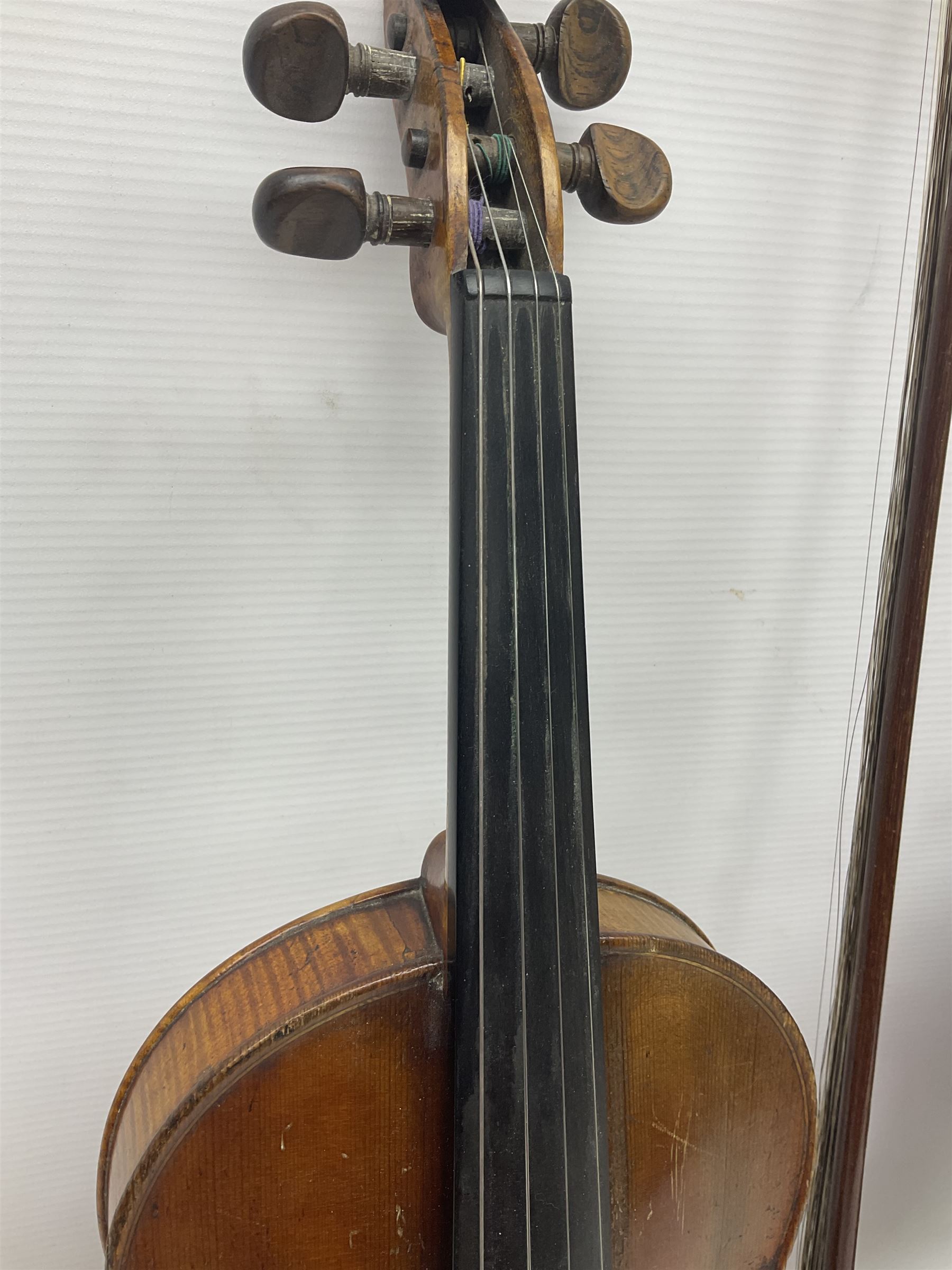 German trade violin in the Steiner style c1900 with 35.5cm two-piece maple back and ribs and spruce top L59cm overall; in fitted carrying case with two bows; and a Saxony violin with 35.5cm one-piece maple back and ribs and spruce top L58.5cm overall (2)