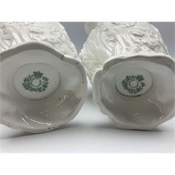 Pair of early/mid 19th century Copeland and Garrett white glazed pitchers, modelled in the Georgian style and moulded with the figures of Venus the Roman Goddess of Love, and Aurora the Roman Goddess of Dawn, within C scroll borders and foliate surround, the naturalistically modelled handle leading to a fruiting vine beneath the rim, upon a spreading base moulded with seashells, with printed green crowned wreath mark beneath, H20cm