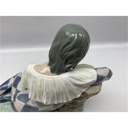 Lladro figure, Harlequin Reclining, modelled as a recumbent harlequin, no 5128, Sculpted by Salvador Furio, year issued 1982, year retired 1987, H28cm 
