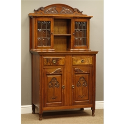  Edwardian walnut side cabinet, raised carved back above two display cabinets enclosed by leaf glazed doors, two figured drawers and two cupboards, W88cm, H160cm, D48cm  