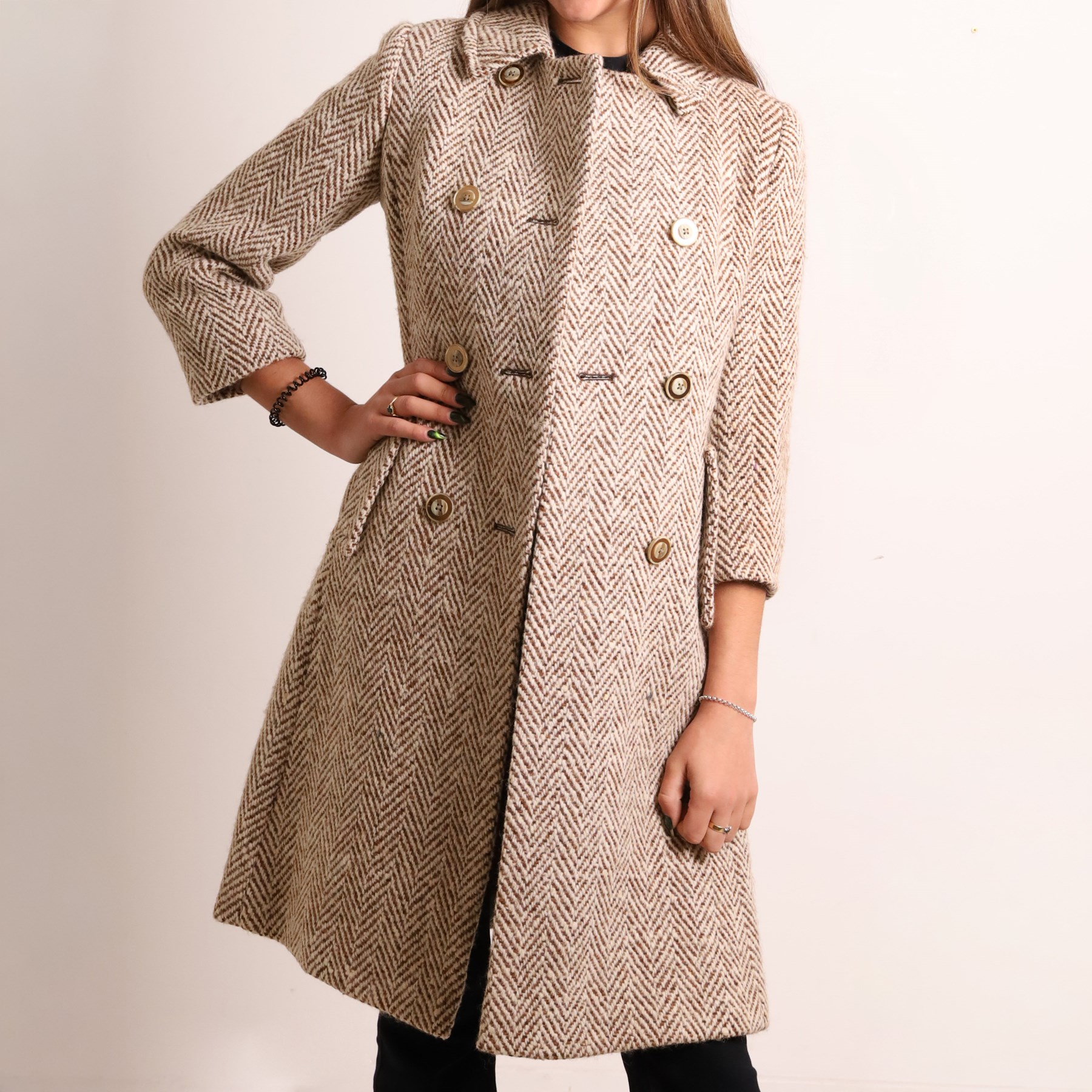 Barbour and Aquascutum - three ladies’ coats, comprising a Barbour Classic Duffle in dark brown wool blend with toggle fastenings and signature tartan lining, size UK 8, together with two Aquascutum herringbone wool coats, each double-breasted and fully lined, both bearing Regent Street London labels (3)