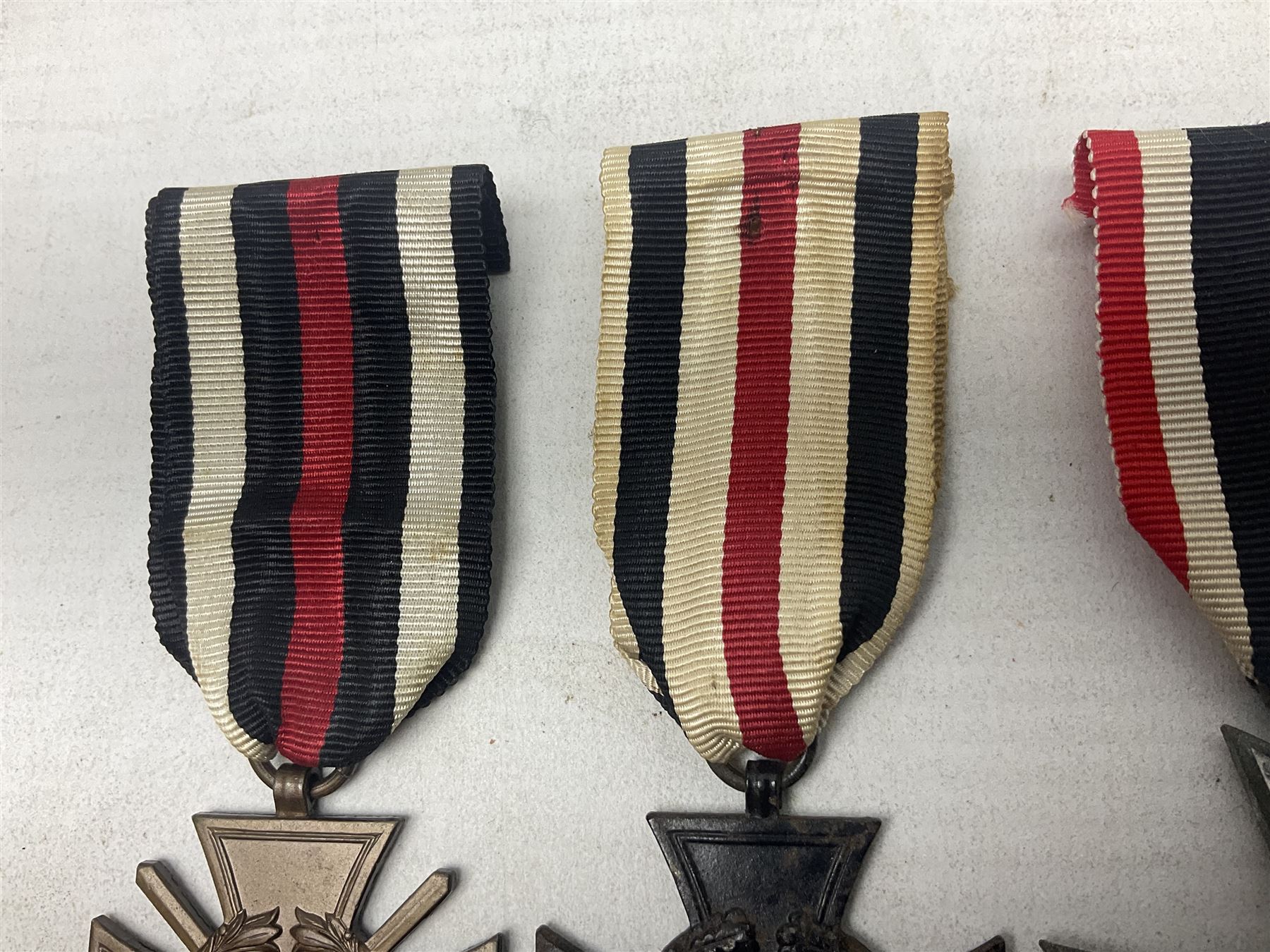 Two WW1 German medals - copy Cross of Honour with swords (combatants); Cross of Honour without swords (non-combatants); and two WW2 German medals - War Merit Medal; and War Merit Cross; all with ribbons (4)