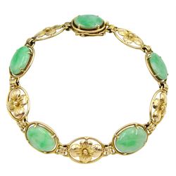 Gold oval jade and flower link bracelet, stamped 14K
