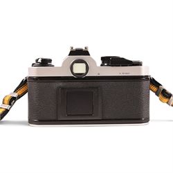 Nikon FM2 film camera body serial no. 7814849 with a Sigma 24mm lens serial no.5083190, camera user manual and Nikon carrying case