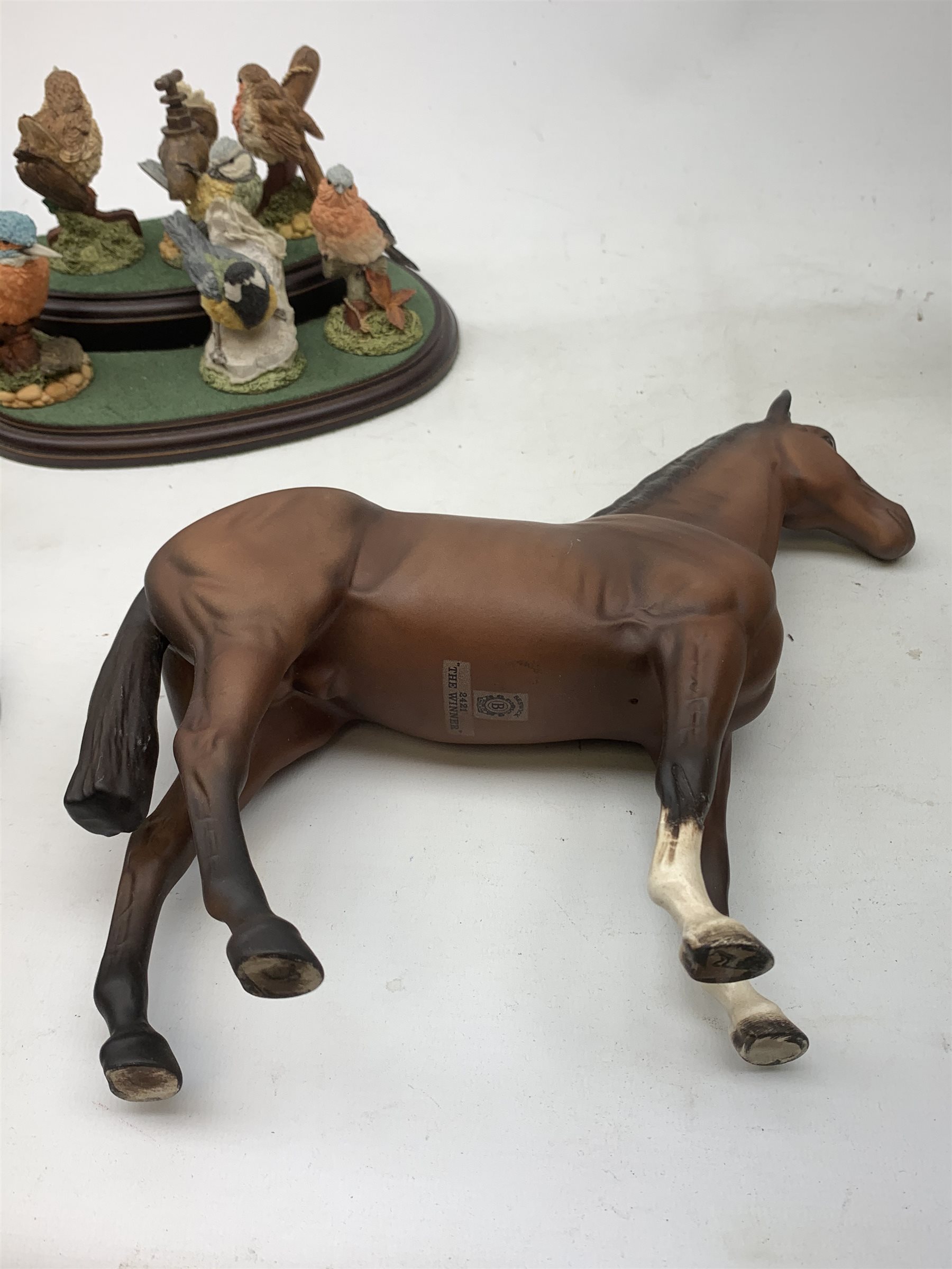 Three Beswick horses comprising: 'The Winner' no. 2421,  Shire Horse and Dale Pony (a/f), Border Fine Arts group 'Feeding Piglets' A5030, Beswick Beatrix Potter figure,  set of six Royal Doulton birds on stand etc 