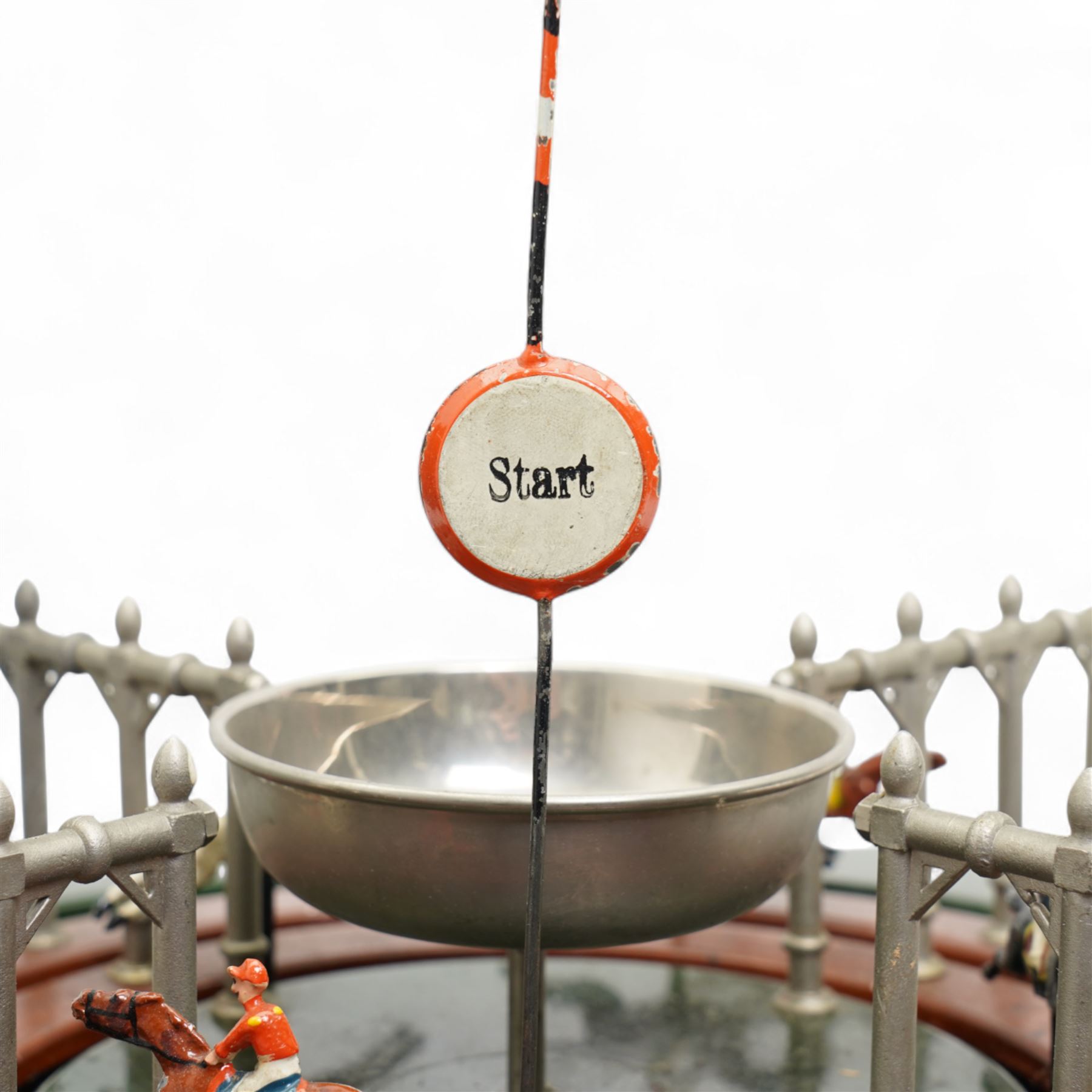 Marklin tin plate lever operated horse racing game with nine numbered horses slotted into tinplate track, wooden box with lift off lid 36cm square