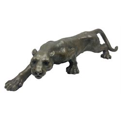 Bronze figure, modelled as a cougar in crouching pose, after Milo and with foundry mark, L40cm. 