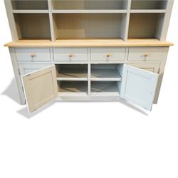 Cotswold Company - 'Chester' dresser painted dove grey with contrasting oak top, the upper rack divided into nine open shelves with panelled back, the lower section fitted with four drawers and cupboard doors enclosing storage compartments
