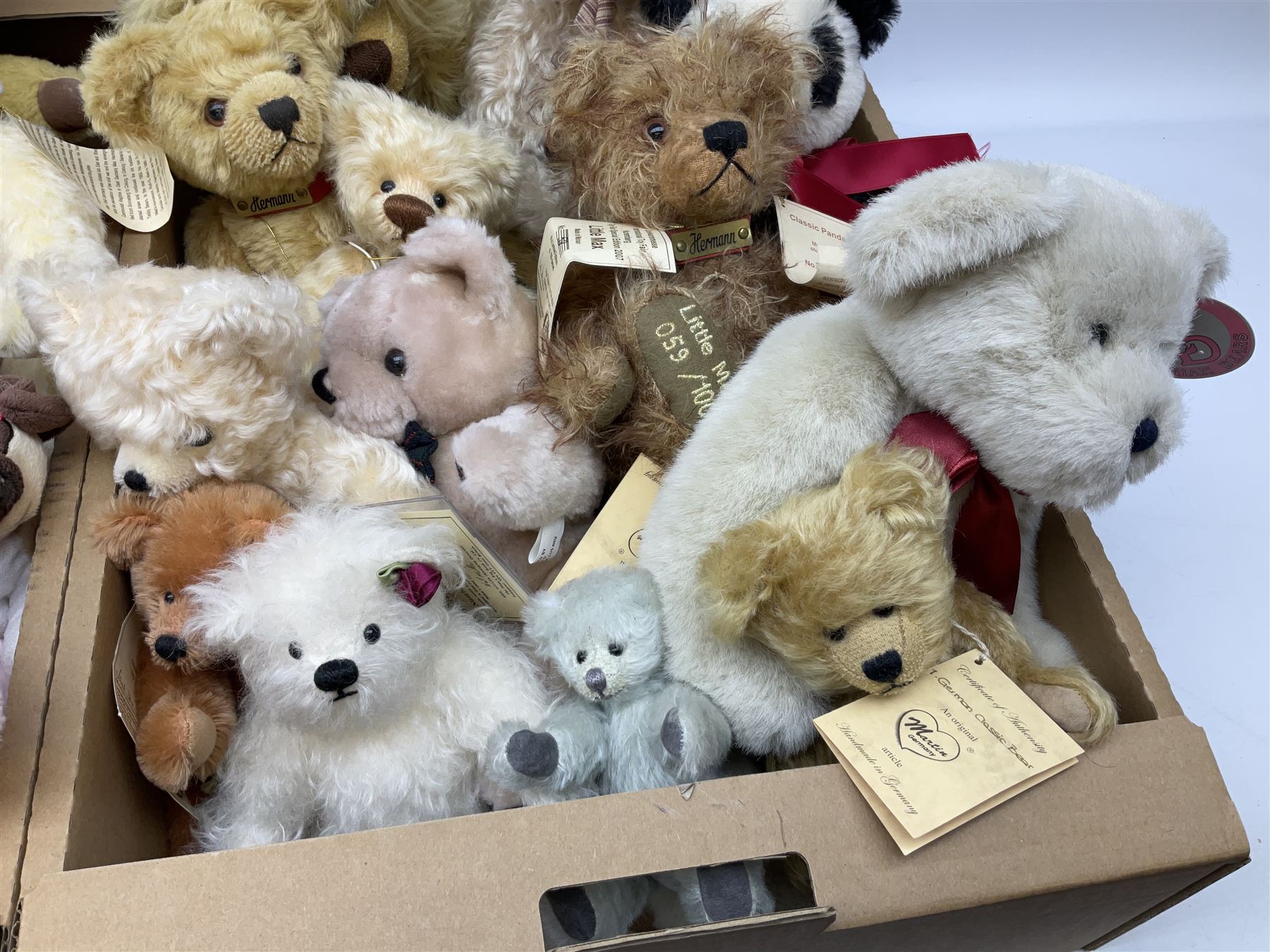 Quantity of teddy bears, predominantly Hermann examples, to include limited edition examples, Little Hilde, Classic Panda Bear, A Handful of Joy, etc, together with Merrythought bear, Martin Germany bears, bear with growler etc in two boxes