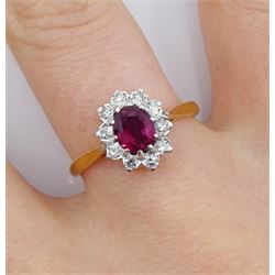 Gold oval ruby and diamond cluster ring, stamped 18ct Plat, ruby approx 0.70 carat