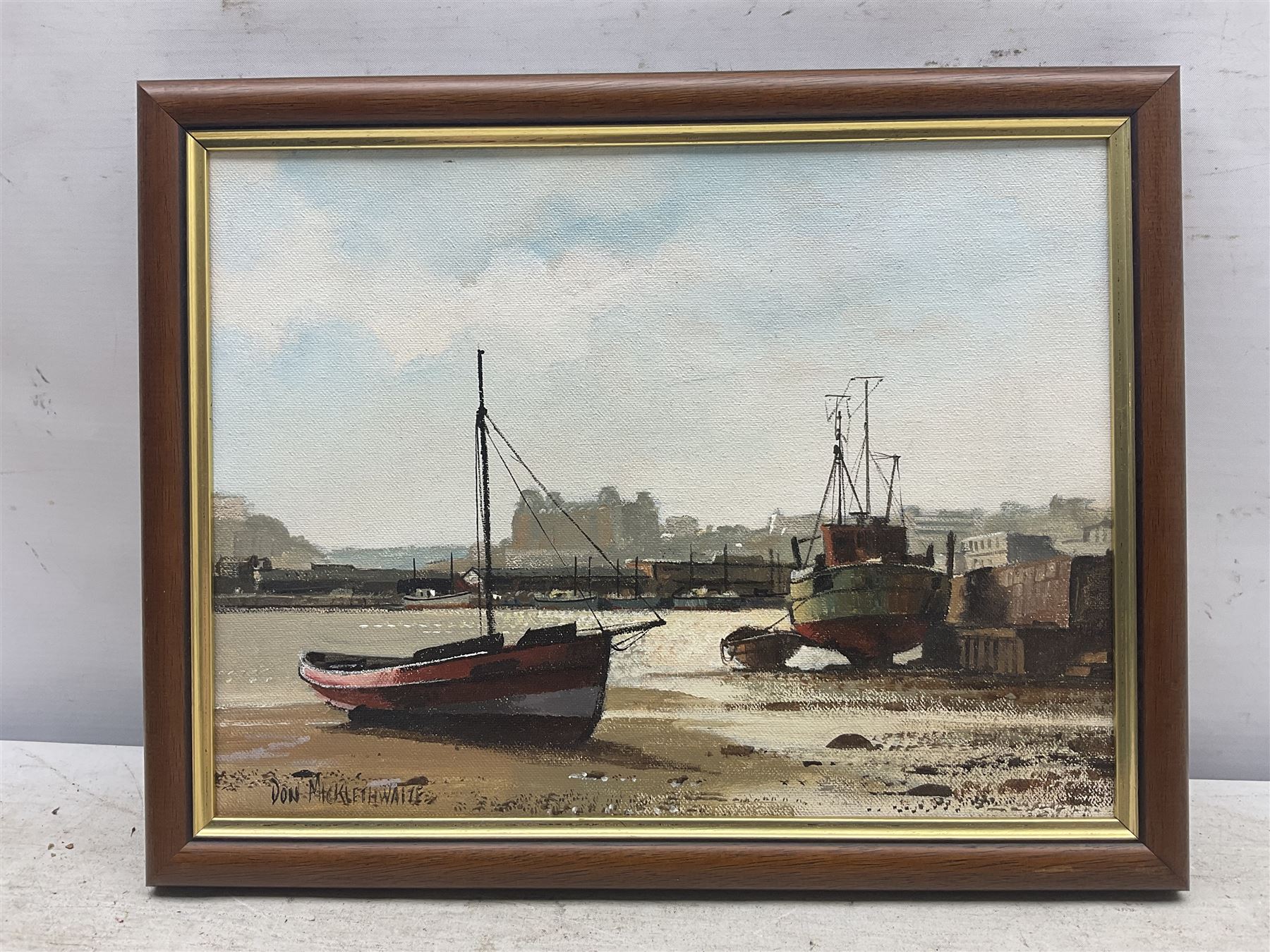 Don Micklethwaite (British 1936-): Scarborough Harbour at Low Tide, oil on canvas board signed 22cm x 29cm 