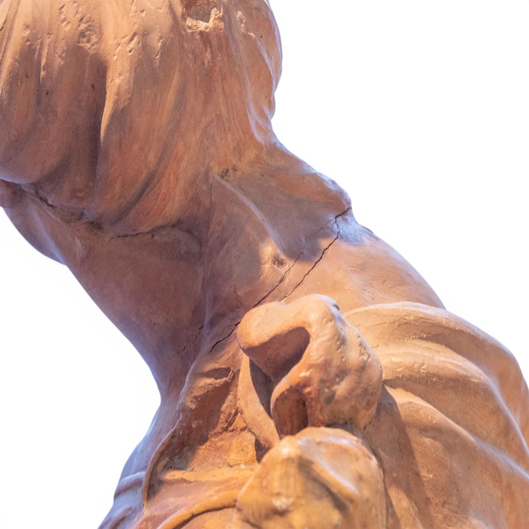 Neoclassical style terracotta statue depicting a draped allegorical female figure, possibly the Goddess Demeter, in contrapposto pose, with one leg slightly forward, wearing an off-shoulder flowing garment, holding a cluster of fruits and flowers raised on a square wooden plinth base. 