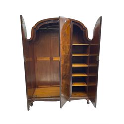Early to mid-20th century burr walnut triple wardrobe, the crossbanded and bookmatched veneer doors enclosing hanging rail and shelves, on cabriole feet