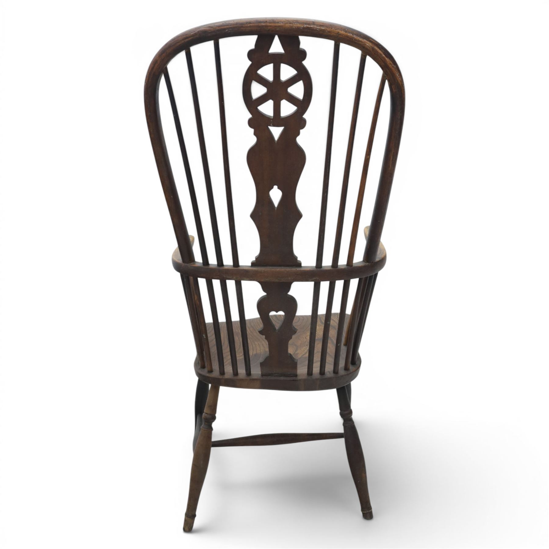 19th century Provincial wheelback Windsor armchair, high stick back, saddle seat on four turned legs with H-stretchers