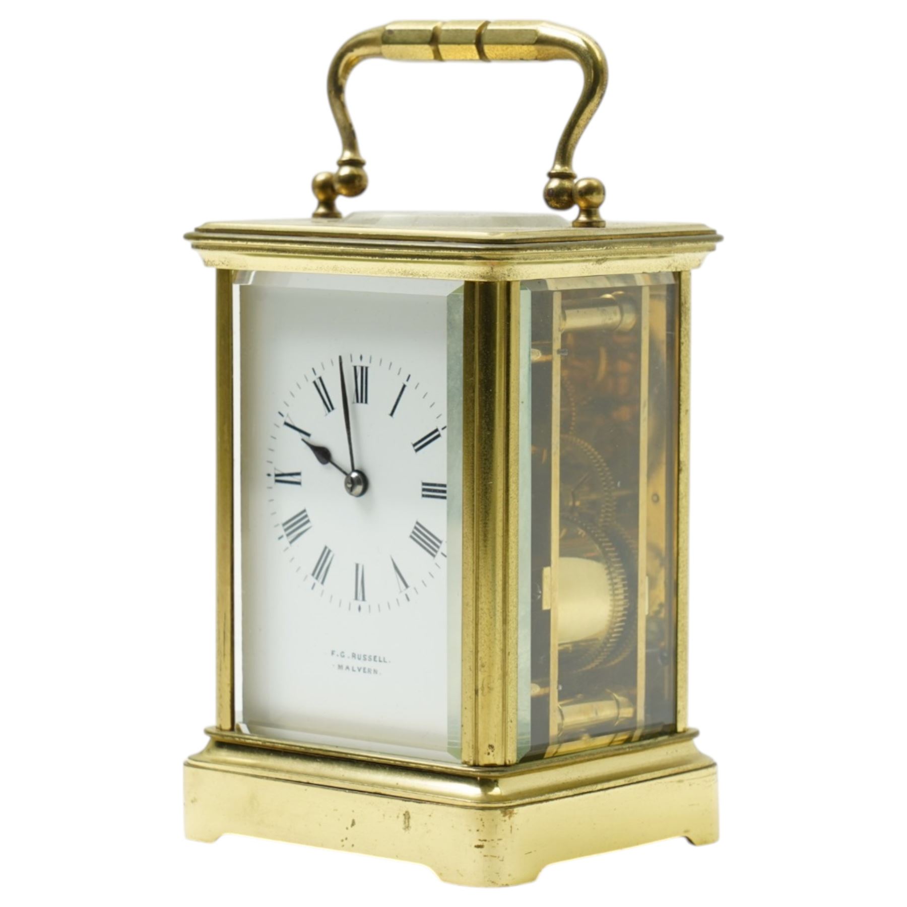 Early 20th century carriage clock, the white enamel dial inscribed F G Russell, Malvern with bell strike in brass and bevelled glass case H12cm