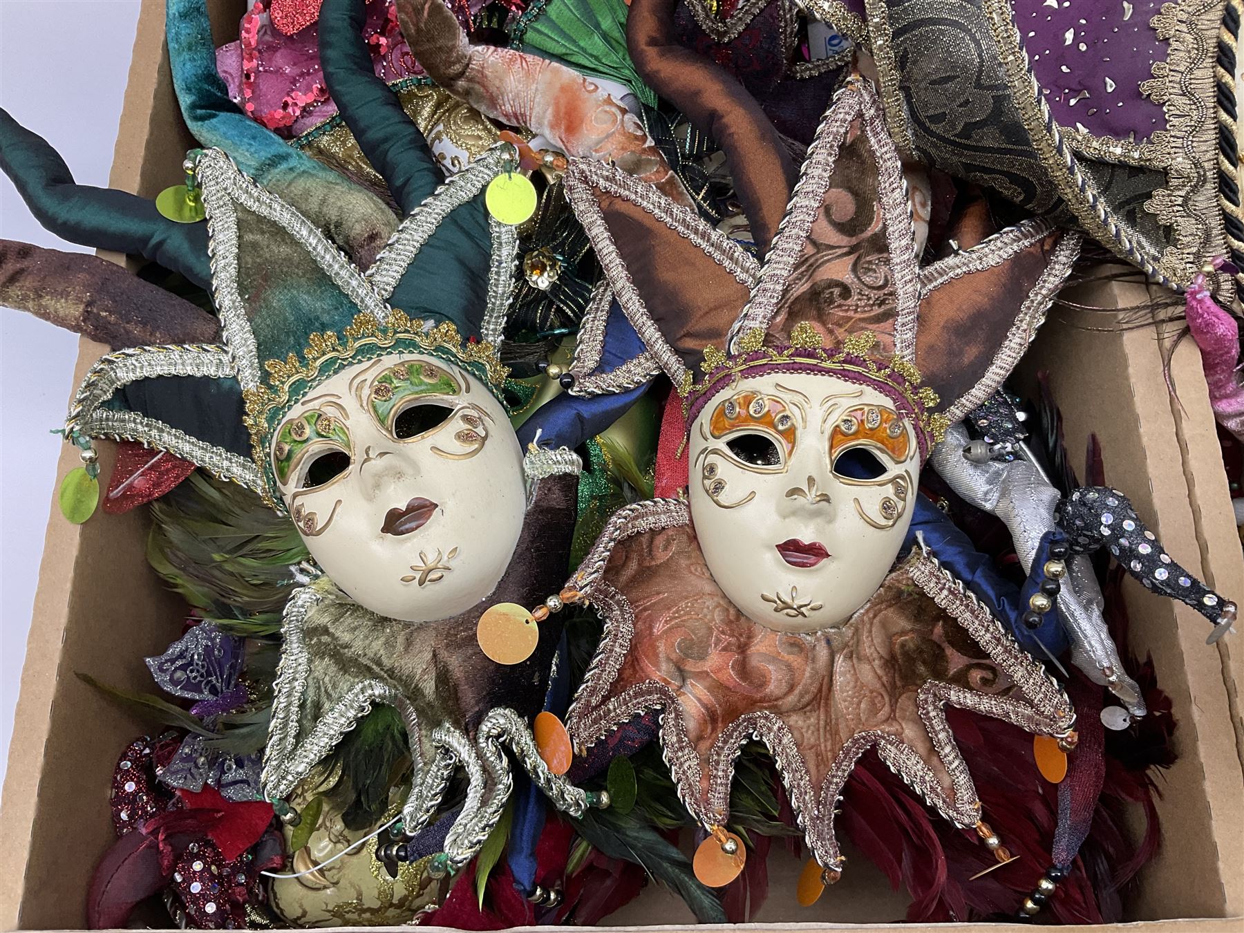 Large collection of decorative Venetian masks, to include two bearing tags for La Maschera Del Galeone, in two boxes 