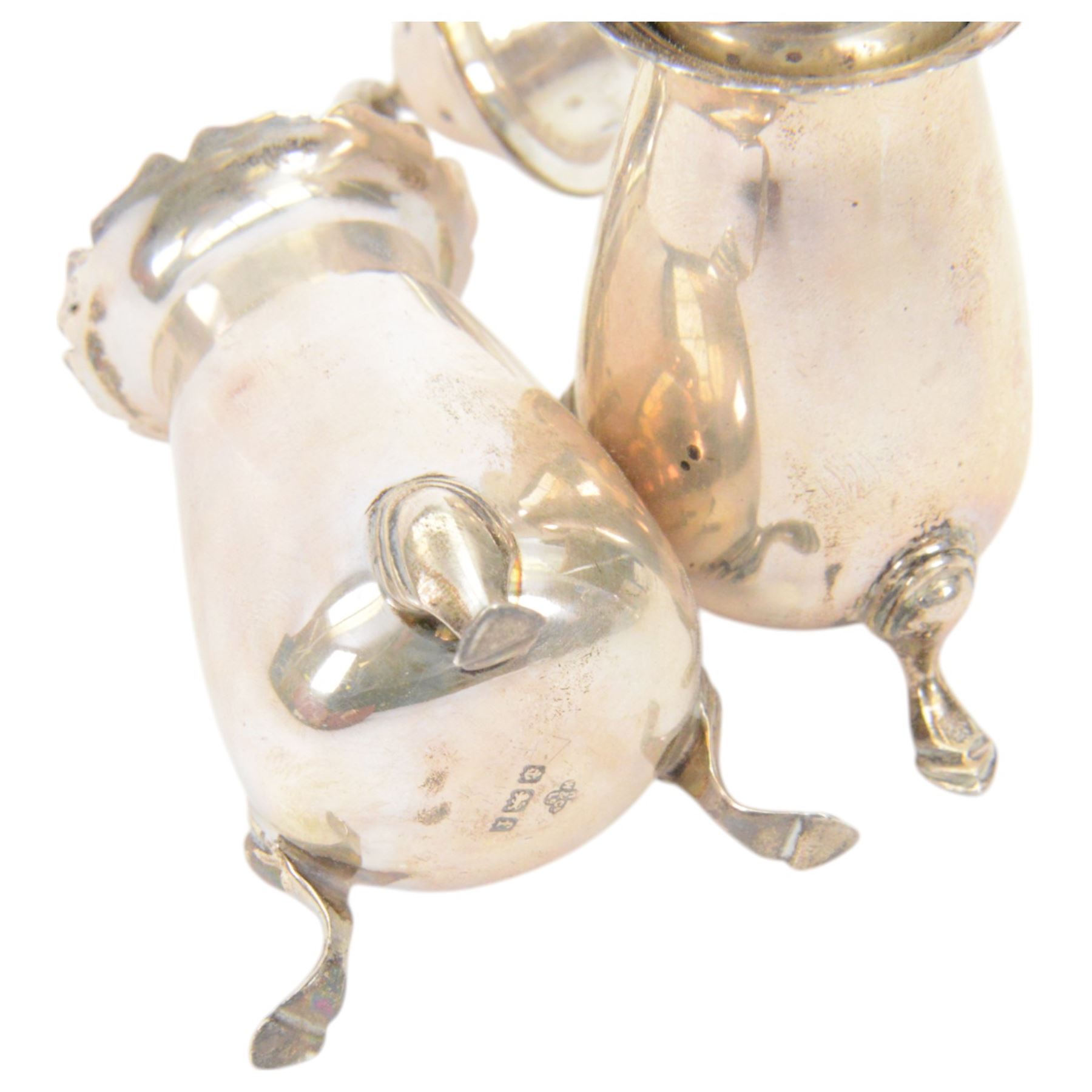 Edwardian silver sauce boat, of typical plain form with shaped rim, with flying C scroll handle and upon three pad feet, hallmarked Birmingham 1907, maker's mark worn and indistinct, together with a pair of Edwardian silver cruets, of urn form, upon three pad feet, hallmarked Horace Woodward & Co Ltd, Birmingham 1905 and a set of six silver apostle spoons, with matching sugar tongs and sugar sifting spoons, some hallmarked Miller Bros, London 1895 and Charles Boynton, all contained within fitted cases