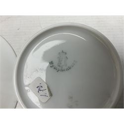 WW2 Nymphenburg cups and saucer, decorated with Imperial German Iron Cross encircled in a foliate boarder with gilt edging, with printed mark beneath 