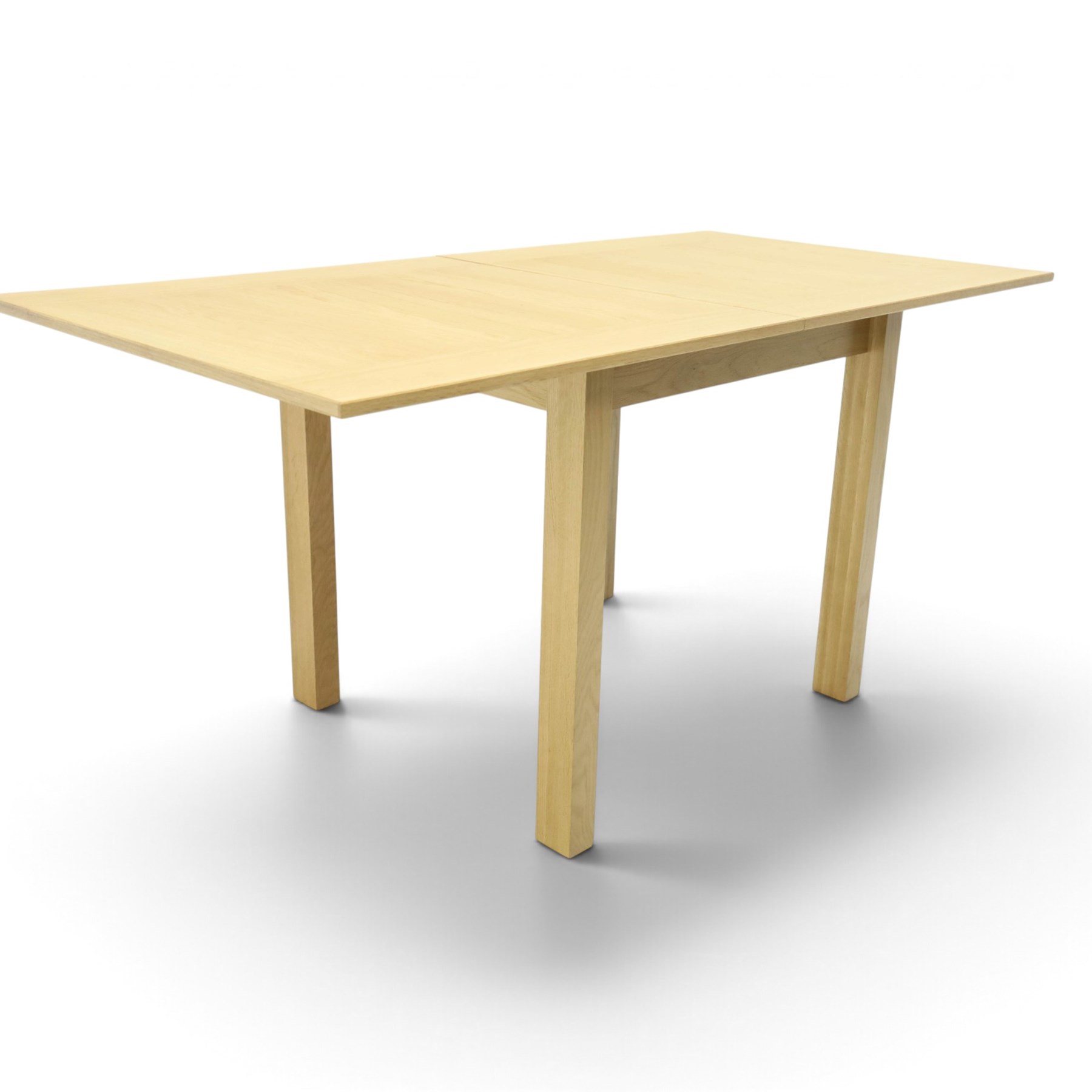 Contemporary light oak extending dining table, the square top with pull-out and fold-over action, raised on square supports