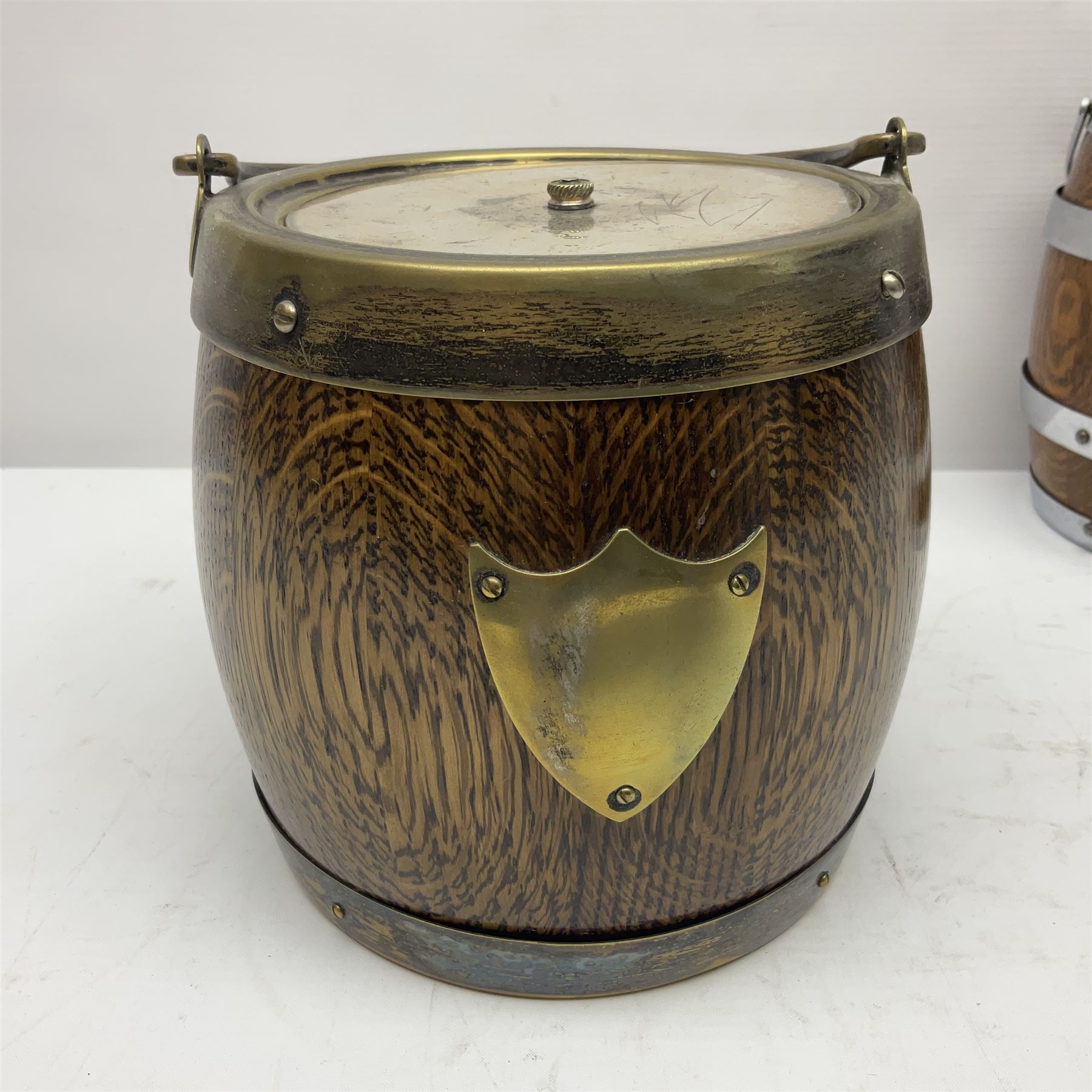 Five early 20th century biscuit barrels with silver-plated mounts