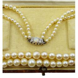 Double strand pearl necklace, graduating pearls between 3mm and 7.5mm, on 18ct white gold old cut diamond and opal milgrain set clasp, boxed