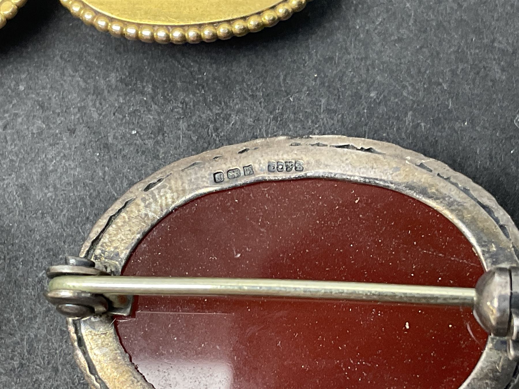 9ct gold jewellery including leaf brooch, wishbone Mizpah brooch, carnelian brooch, gold cased ladies Omega wristwatch, on leather strap and gold cased ladies Tissot wristwatch on expanding gilt strap, together with silver brooches and a Czech paste buckle, etc