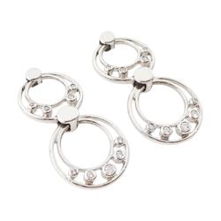 Pair of 9ct white gold diamond pendant earrings, each stud with two circular drops, set with nine round brilliant cut diamonds