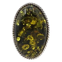 Silver oval Baltic amber adjustable ring, stamped 925 