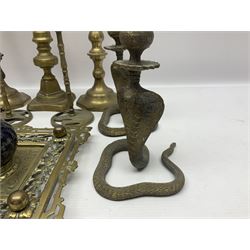 Brass inkstand, of square form, pierced, inset with blue and white ceramic inkwell to centre, together with a collation of brass candlesticks 