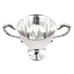 Early 20th century silver trophy cup, the plain bowl upon a circular spreading foot, with twin acanthus capped scroll handles, hallmarked Mappin & Webb Ltd, London 1913, H19cm, approximate weight 16.17 ozt (503 grams)