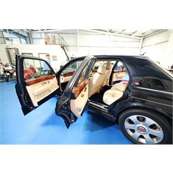 2001 Bentley Arnage Red Label Saloon

Registration: BU51 TGX
Engine: 6.75-litre turbocharged V8 petrol
Transmission: Automatic
Odometer reading: 39,942 miles
Colour: Black Sapphire metallic
Interior: Magnolia leather with burr walnut veneers
Previous owners: 3
V5C: Present
Service history: Good service records

An exceptional Bentley Arnage Red Label Saloon, finished in Black Sapphire metallic, a very dark blue, with a Magnolia leather interior, contrasting dark blue carpets and extensive burr walnut veneers. The car displays an odometer reading of approximately 39,942 miles.

The Arnage Red Label combined Bentley’s renowned 6.75-litre turbocharged V8 engine with automatic transmission, delivering effortless performance in a traditionally appointed luxury saloon. The model is distinguished by its imposing proportions, characteristic Bentley radiator grille and finely crafted interior.

Presented in excellent condition throughout, the bodywork and metallic paint finish appear particularly well preserved, complemented by clean brightwork and the correct Bentley alloy wheels. The engine bay is also notably well detailed.

The interior presents exceptionally well, retaining its Magnolia leather upholstery, polished burr walnut veneers, original factory instrumentation and switchgear. The leather displays only light creasing consistent with careful use.

The car has had three previous owners and is accompanied by good service records.

Features

• 6.75-litre turbocharged V8 petrol engine
• Automatic transmission
• Black Sapphire metallic paintwork
• Magnolia leather interior
• Contrasting dark blue carpets
• Burr walnut veneers
• Electrically adjustable front seats
• Air conditioning
• Factory instrumentation and switchgear
• Bentley alloy wheels
• Right-hand drive
• Odometer reading of approximately 39,942 miles
• Three previous owners
• Good service records
• V5C present

This vehicle forms part of the Estate of the Late John Sills and is offered for sale by the Executors, confirming a genuine reason for sale.