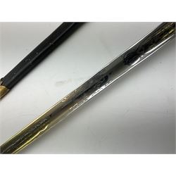 WW1 George V era 1827 Pattern Royal Naval Officer’s sword, the 80cm fullered steel blade decorated with crown, fouled anchor etc and marked Gieves Portsmouth London Edinburgh Devonport to the ricasso, gilded hilt with fouled anchor and crown, wire-bound ray skin grip, lion’s head pommel with mane backstrap, folding/locking langet and full bullion knot; in  leather scabbard having twin brass lockets with hand engraved panels and twin suspension rings L94cm overall. Provenance: By direct family descent from Brian Heathcote HMS Conqueror later Superintendant in the Liverpool Special Constabulary.