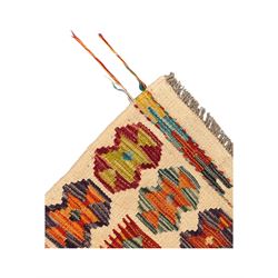 Chobi Kilim flatweave rug, cream ground with a multicoloured geometric diamond field, framed by a bold border of repeating stylised motifs, finished with braided corner tassels