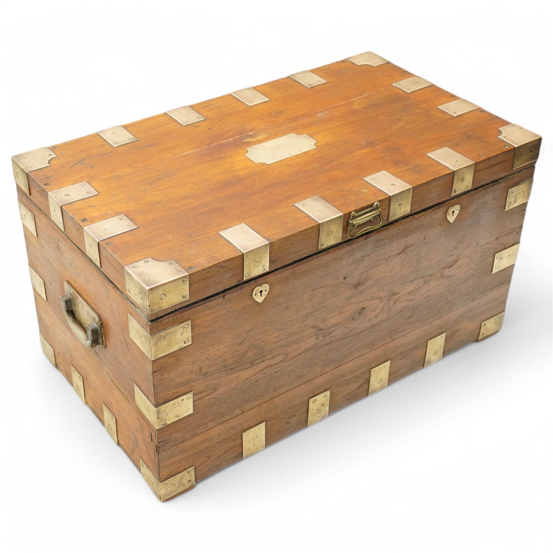 Early 19th century teak and brass bound silver campaign chest, fitted with brass L-shaped brackets and heavy weight carrying handles, the hinged lid enclosing two removeable trays with divisions and lined in blue baize, fitted with two 'R. Cooper & Son' brass locks